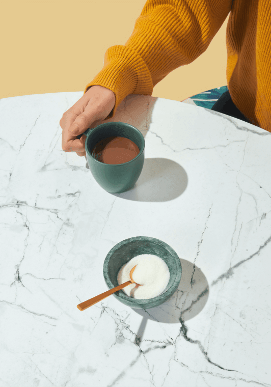 Hand of a person holding a cup of coffee